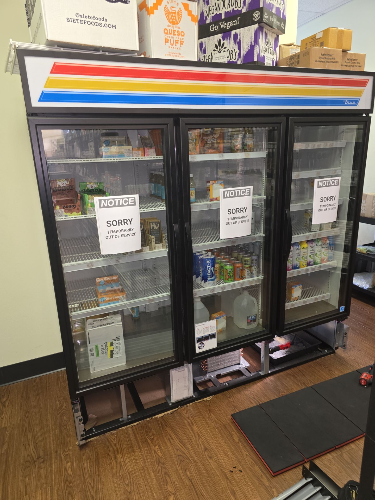 True 3-door glass display cooler with out of service signs - AMB Works commercial True repair Clermont FL