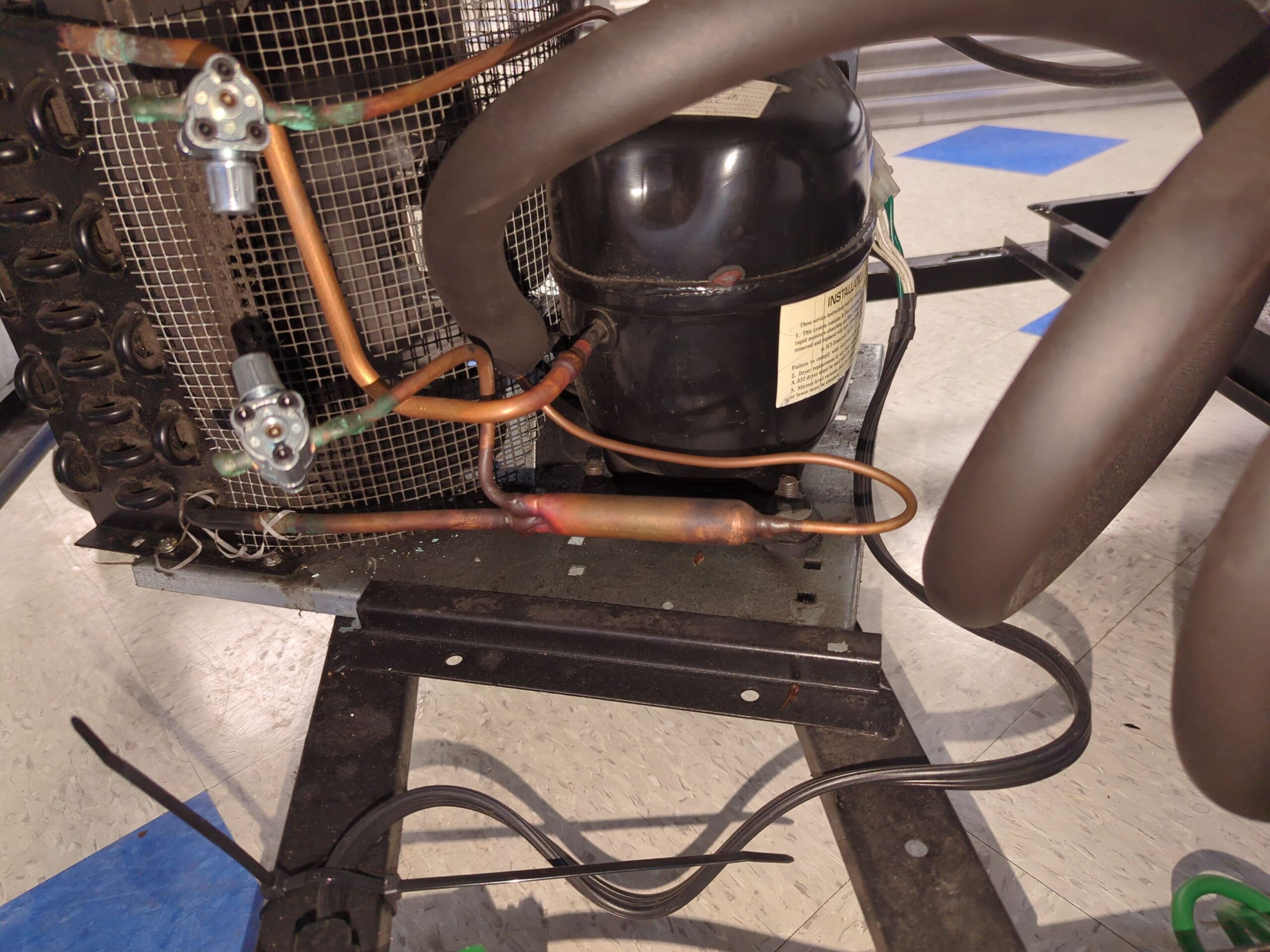 True commercial refrigerator compressor and condenser coil repair