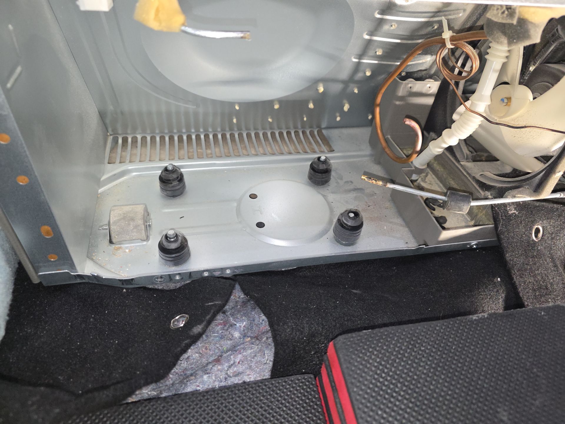 Multimeter testing LG compressor electrical connections