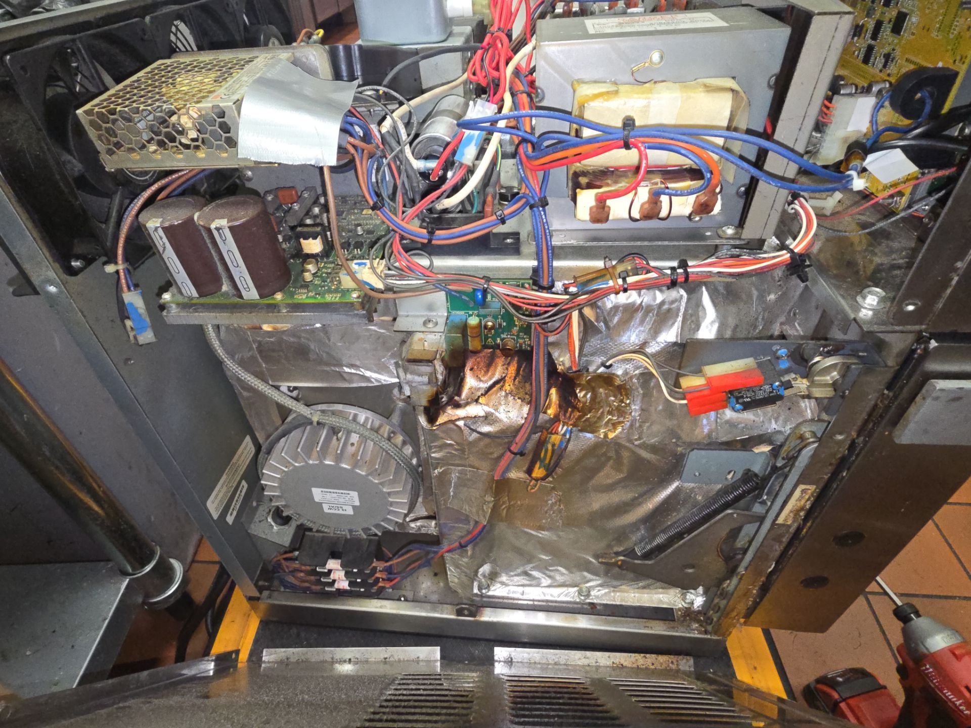TurboChef oven internal components showing control board magnetron and blower motor during repair